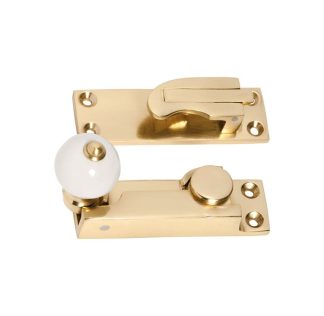 1604 - Sash Fastener - Porcelain Ball - Polished Brass